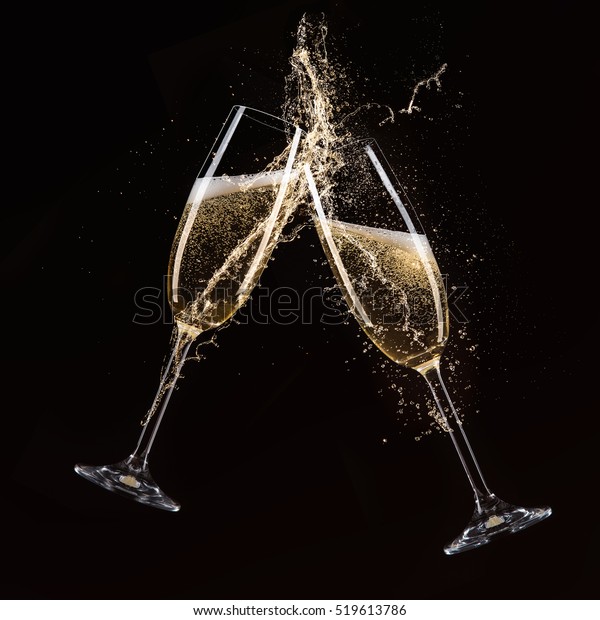 Glasses of\
champagne with splash, celebration\
theme.