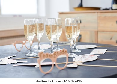 Glasses With Champagne, White Wine On Grey Table At Bridal Shower. Bachelorette Hen Party Decorations In Light Room. Party Time. 