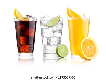Glasses of cola and orange soda drink and lemonade sparkling water on white background with ice cubes lemons and lime bits
