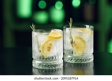 Glasses of cold gin tonic on table in bar