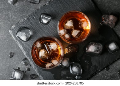 Glasses of cold whiskey on dark background - Powered by Shutterstock