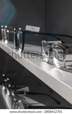 glasses correcting vision with maximum dioptrics for problems of astigmatism and myopia, made to order in a optician's workshop on the shelf of a store selling goods for vision and contact lenses