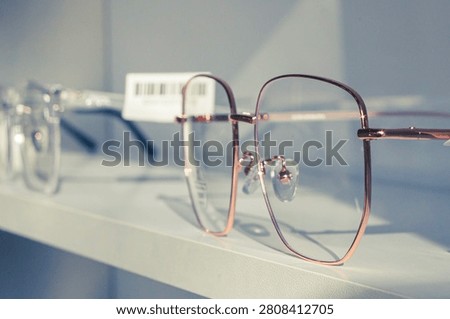 glasses correcting vision with maximum dioptrics for problems of astigmatism and myopia, made to order in a optician's workshop on the shelf of a store selling goods for vision and contact lenses