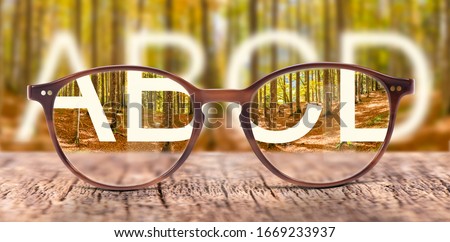 glasses with correction of blur