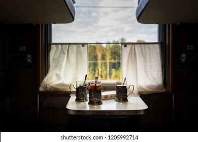 Glasses, Cups Of Tea On The Table In The Train