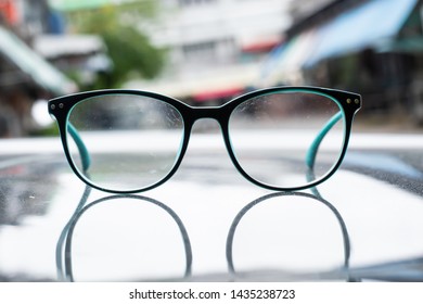 A Glasses With Dirty Lens On Blurred Backgrounds.