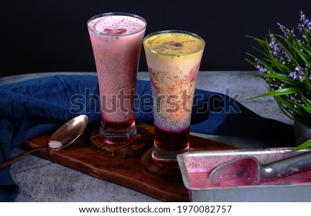 Glasses of falooda with ice cream with pink and yellow color
