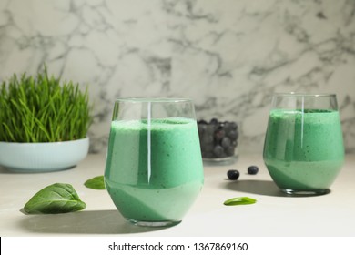 Glasses Of Fresh Spirulina Smoothie On Table