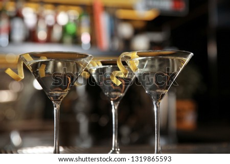 Glasses of lemon drop martini cocktail in bar