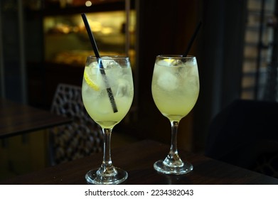 Glasses of limoncello spritz with a slice of lemon and ice cubes - Shutterstock ID 2234382043