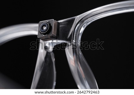 Glasses with mini camera on frame. Close-up. 