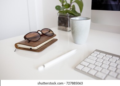 Glasses, notebook and pencil on the desk