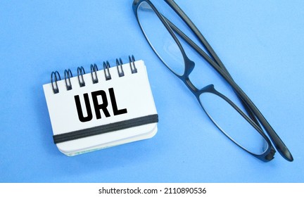 Glasses And Notebooks With URL Characters. Website Concept