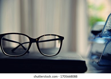 Glasses On The Desk In An Office.