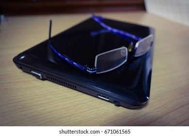 A glasses on A note book computer