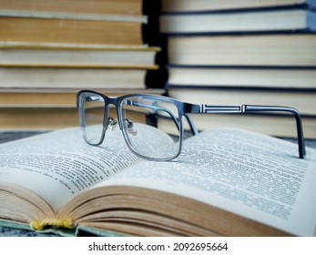  Glasses on an old unfolded book                             