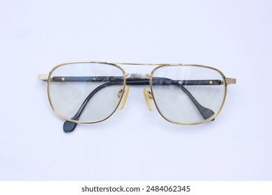 Glasses on White Background with Shadow. A shot of glasses placed on a white background with a subtle shadow, useful for illustrating a clean and minimalist setting. - Powered by Shutterstock