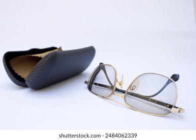 Glasses on White: A straightforward shot of glasses placed on a white background, useful for illustrating a clean and minimalist setting. - Powered by Shutterstock