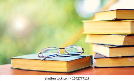 Glasses And Open Book. Best Books Home Library Background. Read Vintage Books In A Row. College Library Table. Publishing