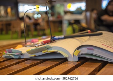 Glasses with an open book in a cafe.