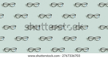 Glasses pattern on green background. Optical store, vision test, stylish glasses concept. Banner with pattern