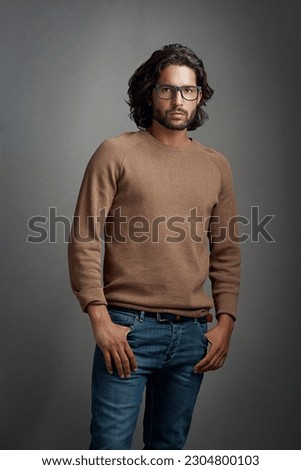 Glasses, portrait and serious man in studio isolated on a gray background. Face, spectacles and handsome male person from Brazil with eyewear or frames for fashion, stylish and aesthetic mockup.