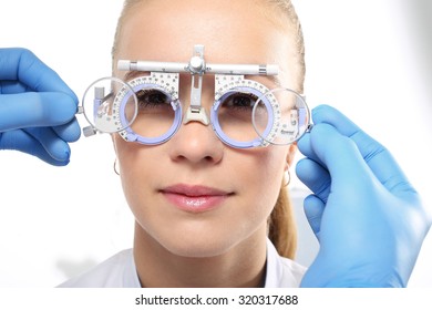 Glasses Progressive Selection Of Corrective Lenses. The Patient At An Ophthalmologist, Selection Of Eyeglass