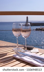 Glasses Of Provence Rose Wine Overlooking The Mediterranean Sea