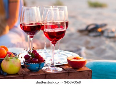 Glasses Of The Red Wine On The Sunset Beach, Picnic Theme

