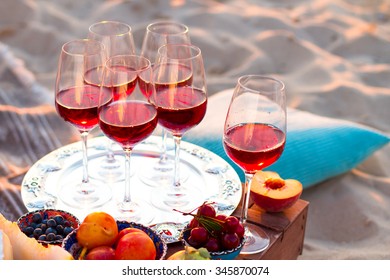 Glasses Of The Red Wine On The Sunset Beach, Picnic Theme

