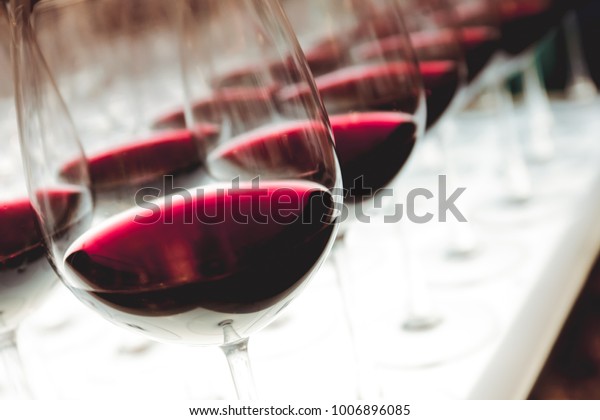 Glasses of red wine with\
vintage filter