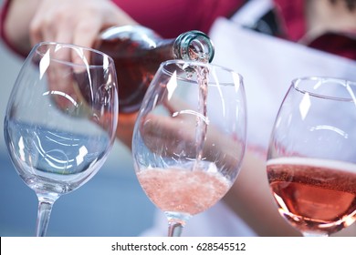 Glasses of rose wine from a bottle - Powered by Shutterstock