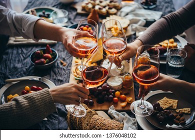 Glasses of rose wine seen during a friendly party of a celebration. - Shutterstock ID 1376048102