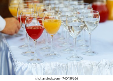 Glasses in a row at a buffet table