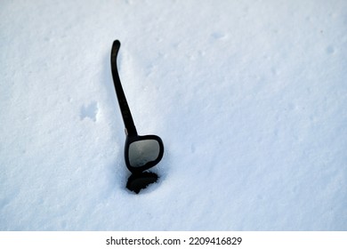 Glasses In A Snowdrift. Lost Eyeglasses. Winter Landscape. Selective Focus.