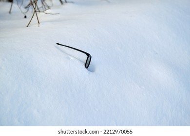 Glasses In A Snowdrift. Lost Eyeglasses. Winter Landscape. Selective Focus.