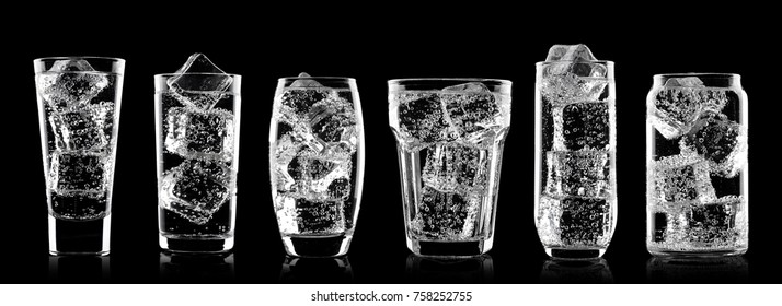 Glasses Of Sparkling Water Soda Drink With Ice On Black Background