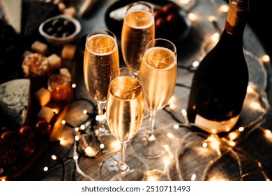 Glasses of sparkling wine or champagne served on the table for Christmas or New Year eve celebration. - Powered by Shutterstock