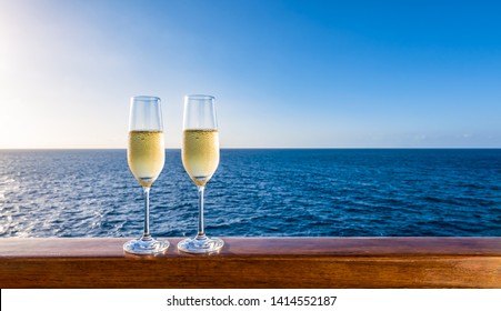 Glasses Of Sparkling Wine On Vacation. Sea Background. Copy Space.