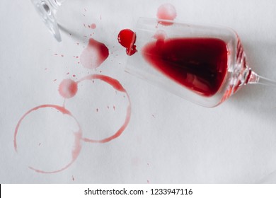 Glasses Of Spilled Red  Wine  On White  Background,  Copy Space.  Wine Degustation Concept