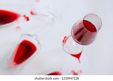 Glasses Of Spilled Red  Wine  On White  Background,  Copy Space.  Wine Degustation Concept