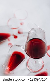 Glasses Of Spilled Red  Wine  On White  Background,  Copy Space.  Wine Degustation Concept