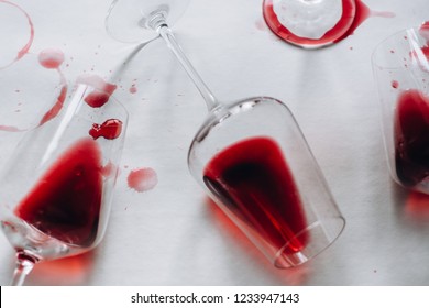 Glasses Of Spilled Red  Wine  On White  Background,  Copy Space.  Wine Degustation Concept