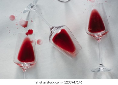 Glasses Of Spilled Red  Wine  On White  Background,  Copy Space.  Wine Degustation Concept