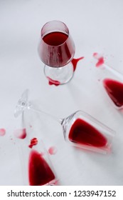 Glasses Of Spilled Red  Wine  On White  Background,  Copy Space.  Wine Degustation Concept