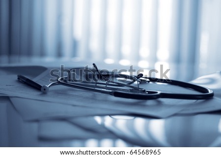 glasses and stethoscope on the table
