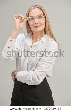 Similar – Young woman stiring coffee looking back