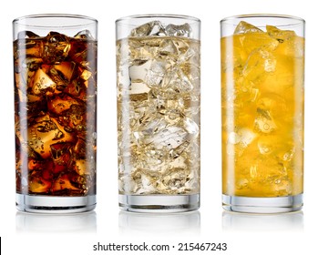 Glasses of sweet carbonated drinks with ice cubes isolated on white. With clipping path