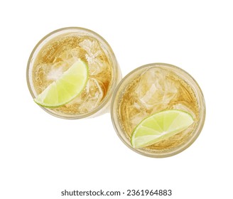 Glasses of tasty ginger ale with ice cubes and lime slices isolated on white, top view