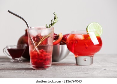 Glasses Of Tasty Pomegranate Cocktail On Table